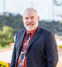 A headshot of Shannon Pfleiderer in front of a park