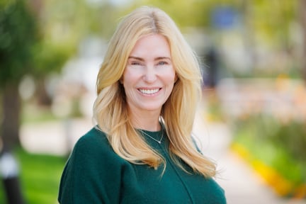 A headshot of Shannon Smith in front of a park