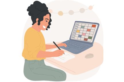 Student at desk doing work on paper and a laptop